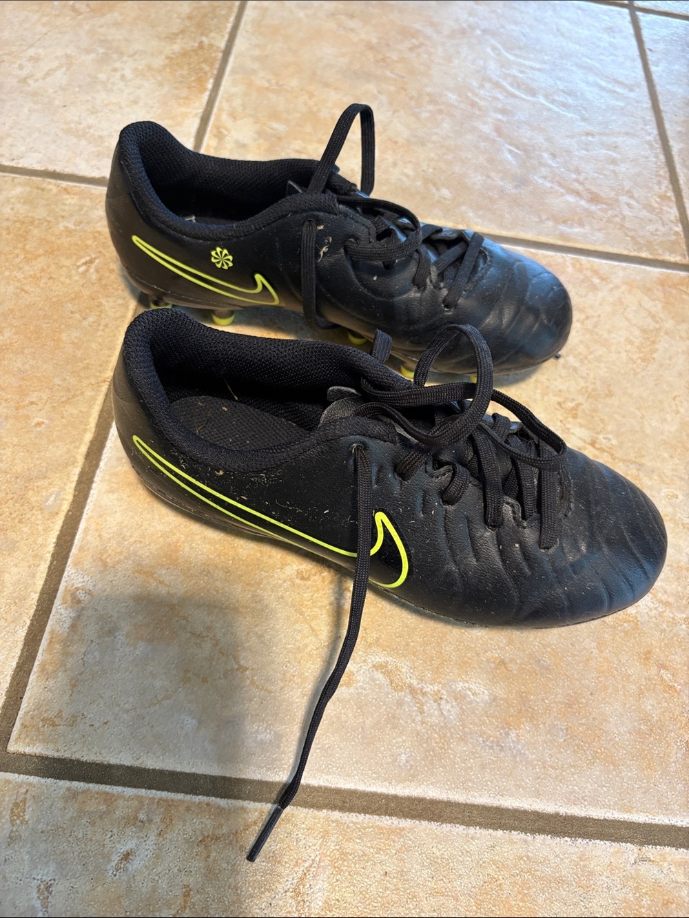 Nike Kids Black Soccer Cleats with Neon Yellow Swoosh